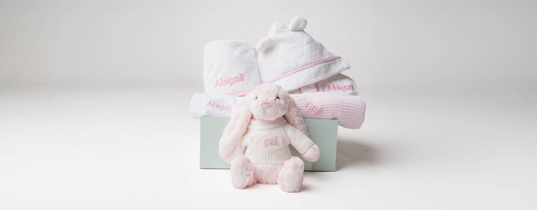 A customized baby gift humper with personalized items bunny, robe, towel 