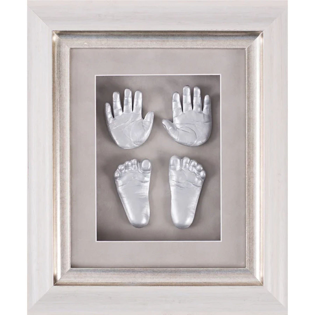Framed impressions of baby hands and feet on a gray background
