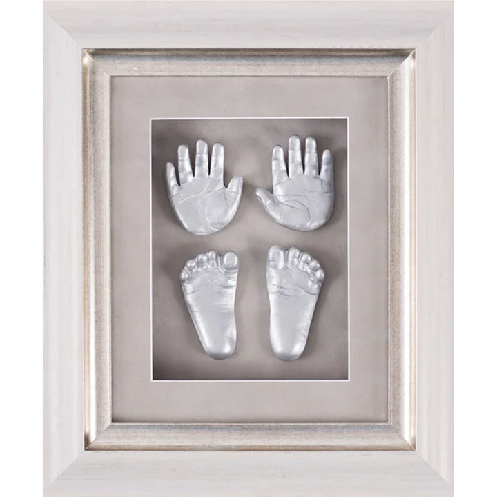 Framed impressions of baby hands and feet on a gray background
