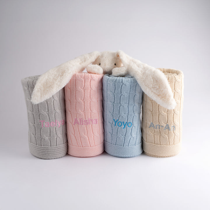 personalised Cable Knit Blanket in blue, cream, pink and grey