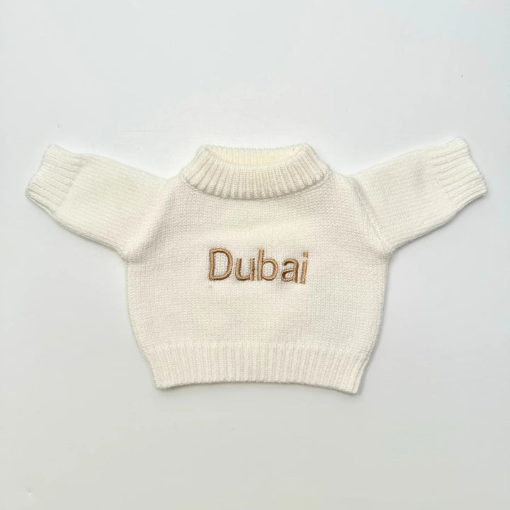 Close-up embroidery detail on Dubai personalized teddy bear jumper.