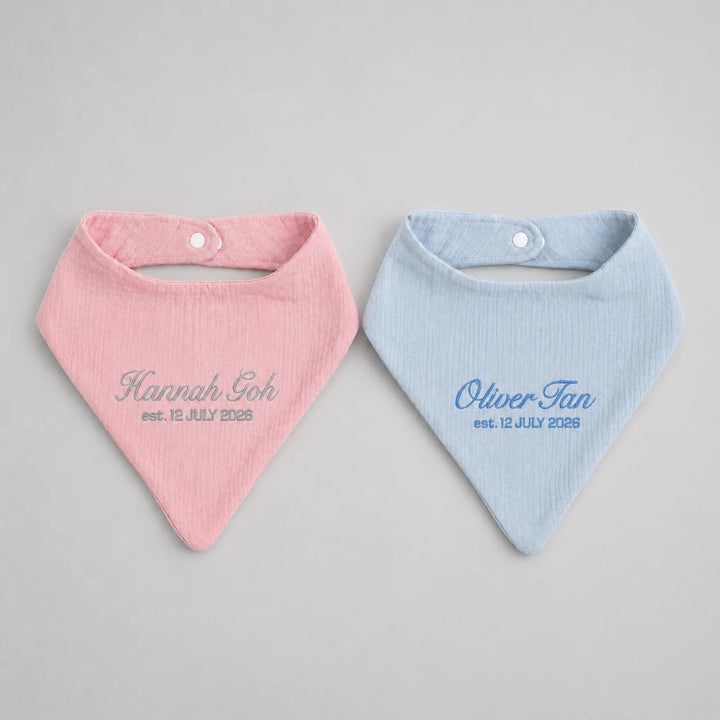 Personalised baby bib collection in pink, and blue with embroidered names and birth dates