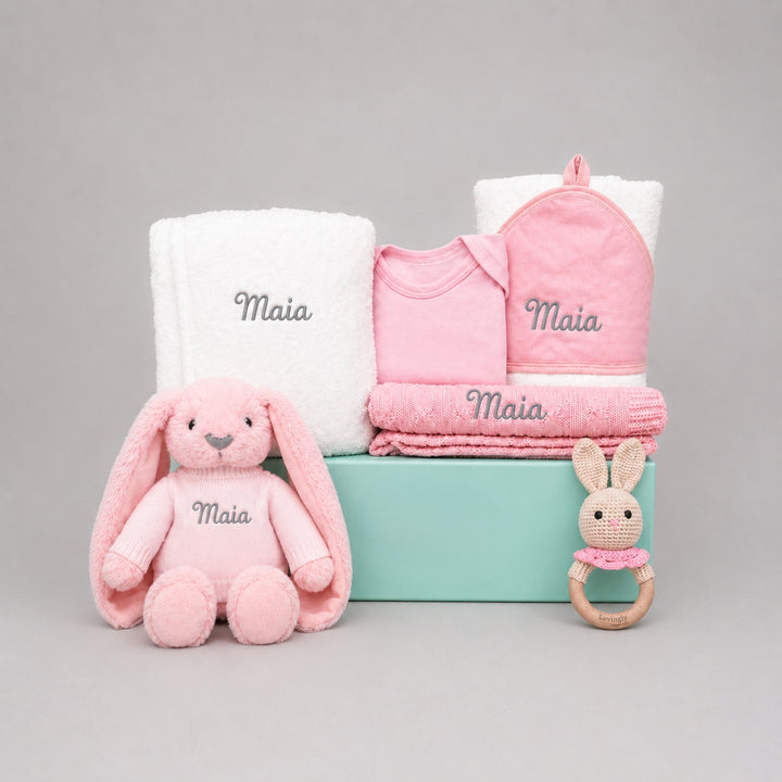 Baby gift set with plush toys and blankets in a box, personalized with 'Maia'.