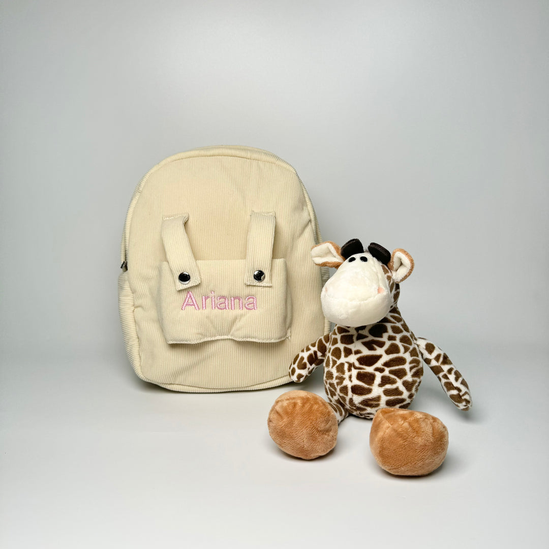 children backpack with giraffe soft toy and "Ariana" personalised in pink thread