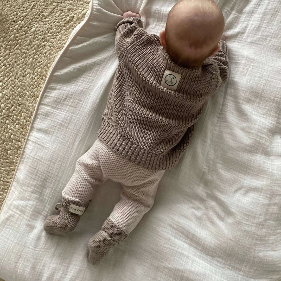 Baby wearing Cosy Roots Organic Knit Booties - Caramel