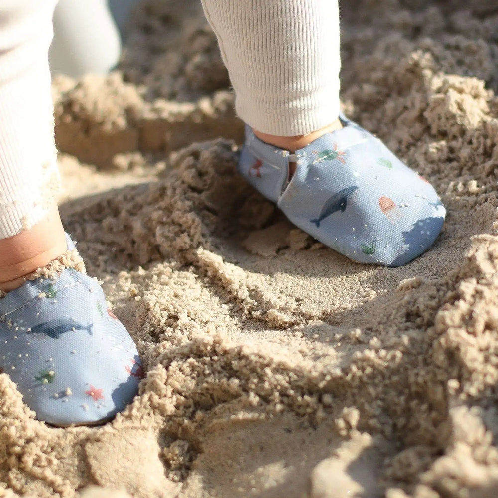 Toddler wearing Cosy Roots Vegan Shoes - Sea Buddies on Sand