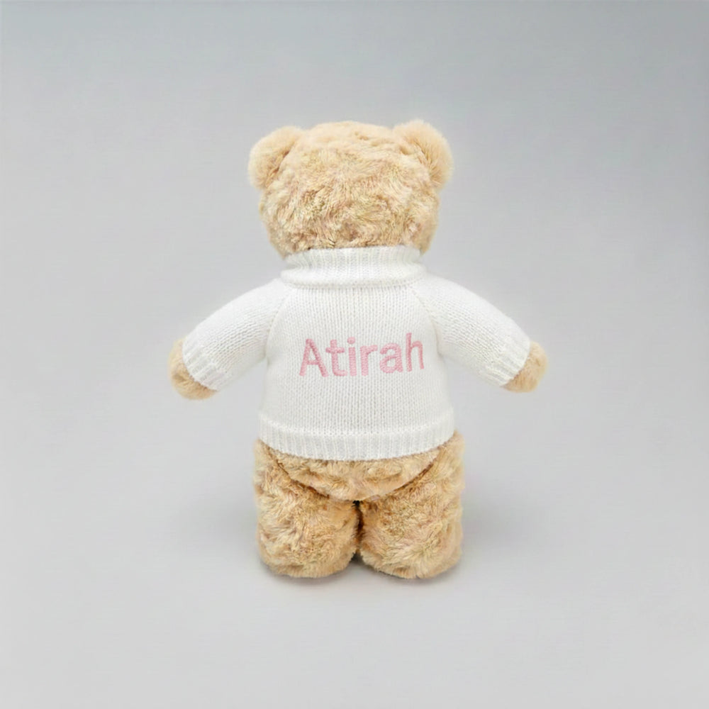 Soft plush teddy bear gift for Eid with custom name on jumper.