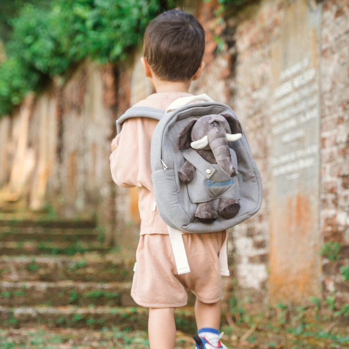 Boy carrying elephant bag personalised in blue thread