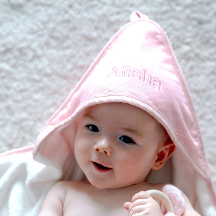 Baby covering in Pink Bamboo Hooded Towel with "Alisha" customised in Pink thread