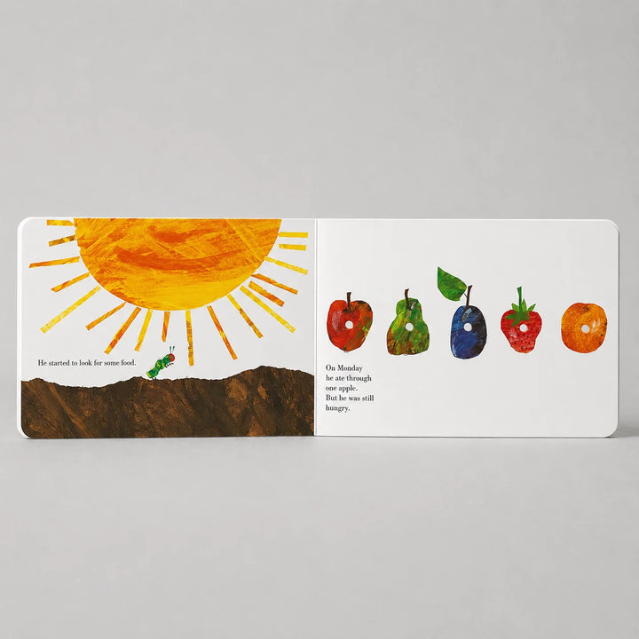 The Very Hungry Caterpillar Board Book Open to Colourful Fruit and Caterpillar Feeding Pages