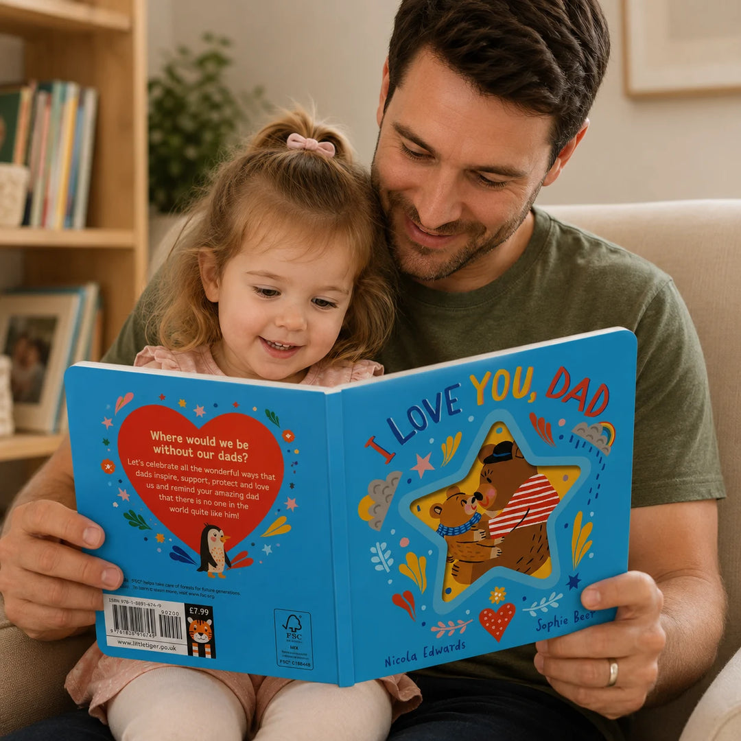 Father Reading I Love You, Dad Board Book with His Toddler in a Cozy Home Setting
