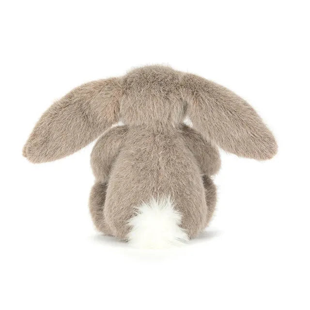 Jellycat Fawn Flufflet Bunny soft toy in taupe brown, shown from behind with long floppy ears and a fluffy white tail.