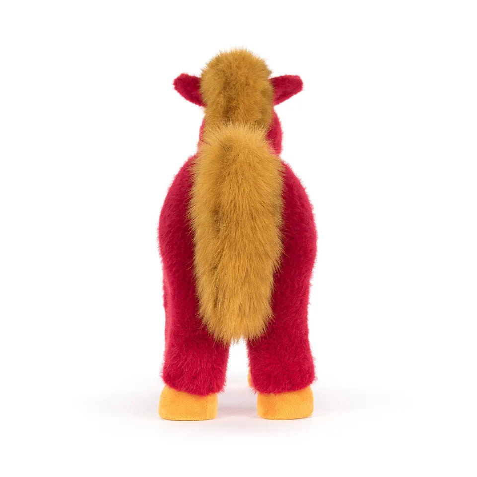 Rear view of the Jellycat Festival Horse plush showing its fluffy golden mane and long golden tail against a white background.