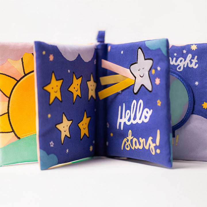 Children's soft book with star illustrations and text on a white background