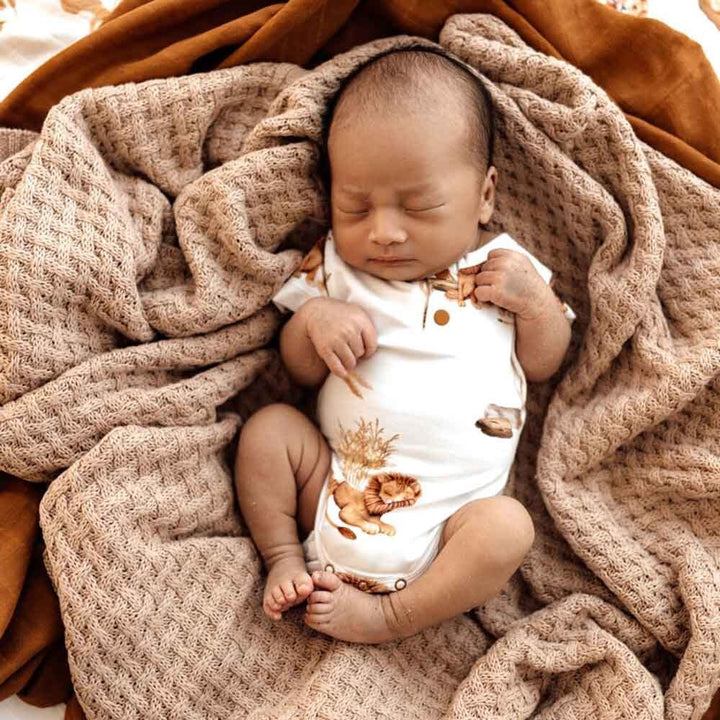 Baby wearing Snuggle Hunny Lion Short Sleeve Organic Bodysuit
