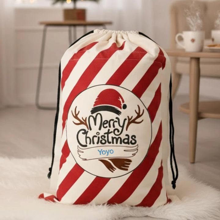 Red and white striped drawstring sack with 'Merry Christmas' design and "Yoyo" personalized on a light background.