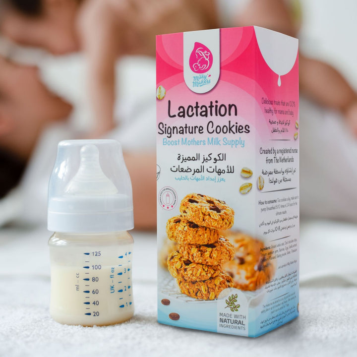 Milky Makers Lactation Signature Cookies packaging beside a baby milk bottle, with a mother and baby in the background.