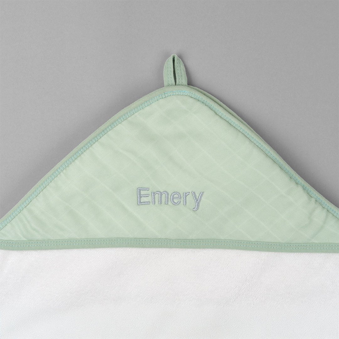 Closeup of Green Bamboo Hooded Towel with "Emery" embroidered in Grey thread