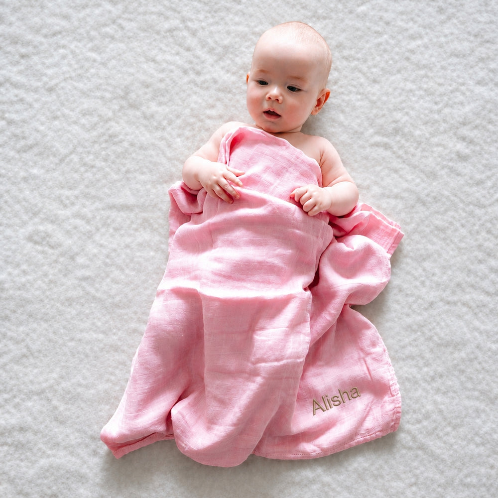 Baby covering in Pink Bamboo Swaddle