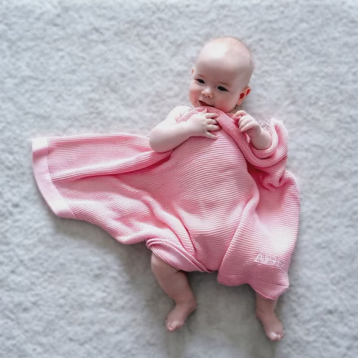 Short Video of Baby covering with Pink Bamboo Cellular Blanket