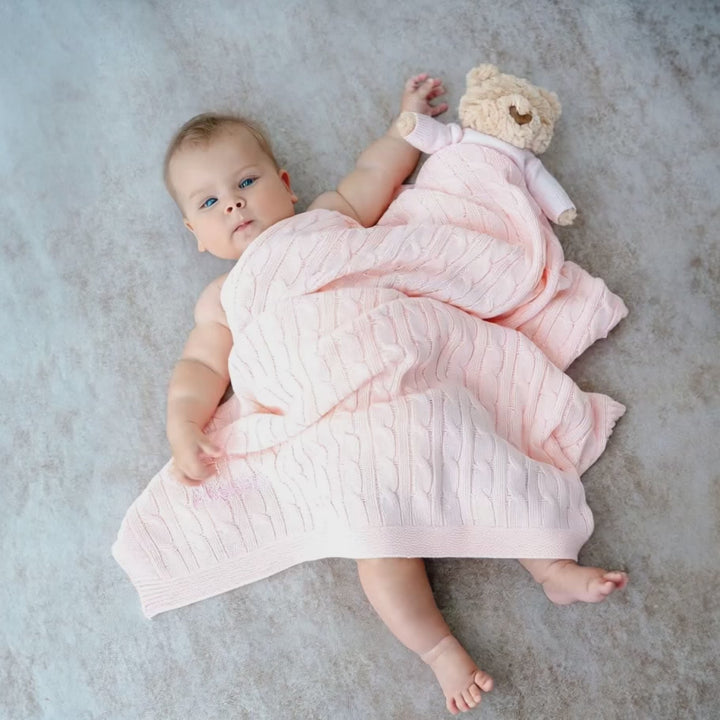 Short Video of Baby covering with Pink Cable Knit Blanket 