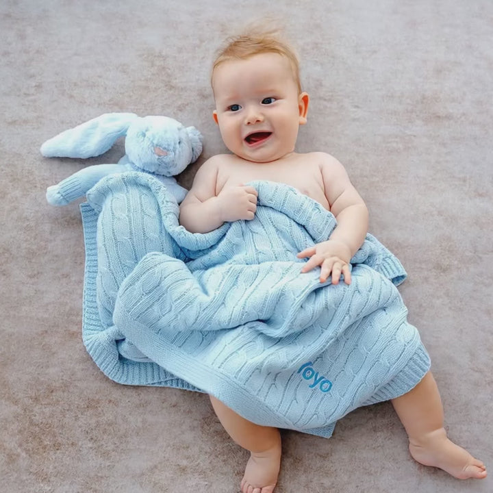 Short Video of Baby covering with Blue  Cable Knit Blanket 