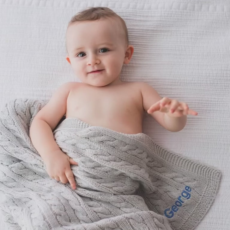 Short Video of Baby covering with Gray Cable Knit Blanket 