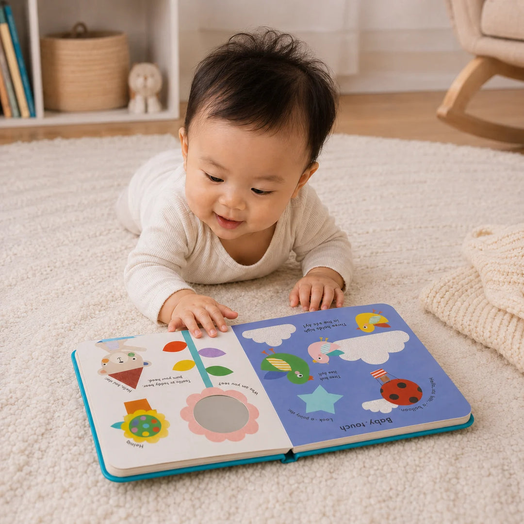 Baby Exploring Baby Touch Playbook During Tummy Time on a Soft Play Mat