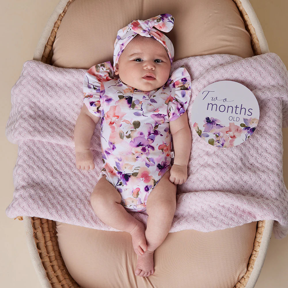 Baby wearing Snuggle Hunny Blushing Beauty Short Sleeve Organic Bodysuit with Frill