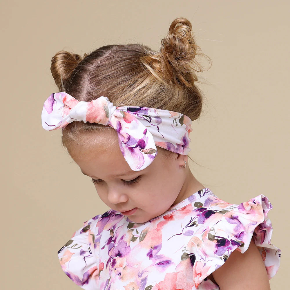 Toddler wearing Snuggle Hunny Blushing Beauty Organic Topknot