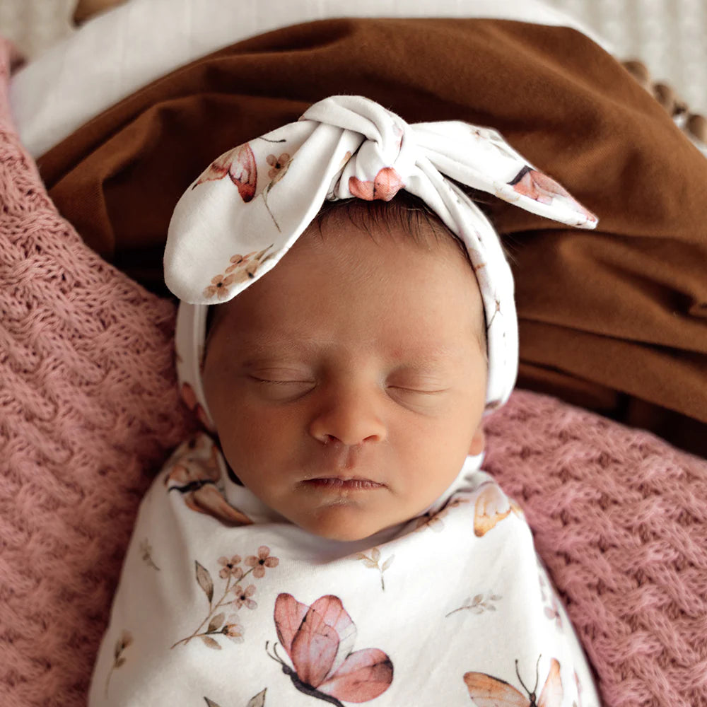 Baby wearing Snuggle Hunny Butterfly Organic Topknot