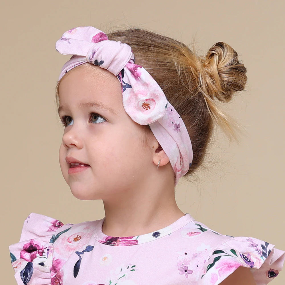 Toddler wearing Snuggle Hunny Floral Kiss Organic Topknot