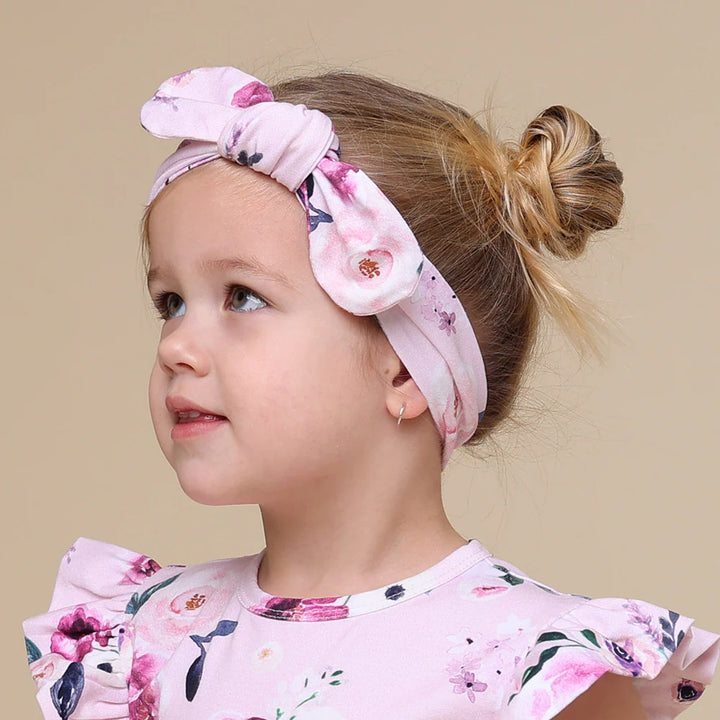 Toddler wearing Snuggle Hunny Floral Kiss Organic Topknot