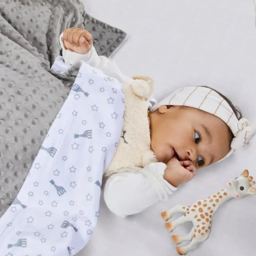 Baby covering with Sophie Doux blanket with Sophie Teether