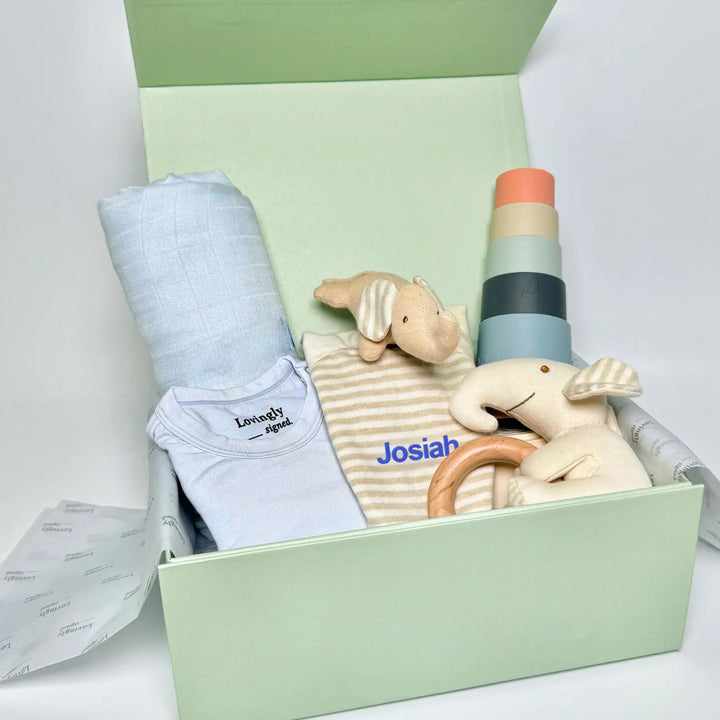 Blue Baby gift set with toys, swaddle and clothing in luxurious gift box