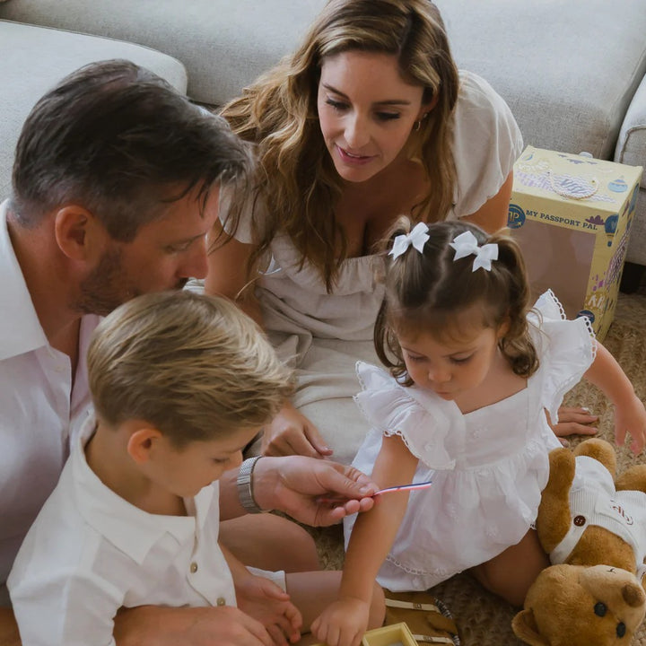 family with teddy bear