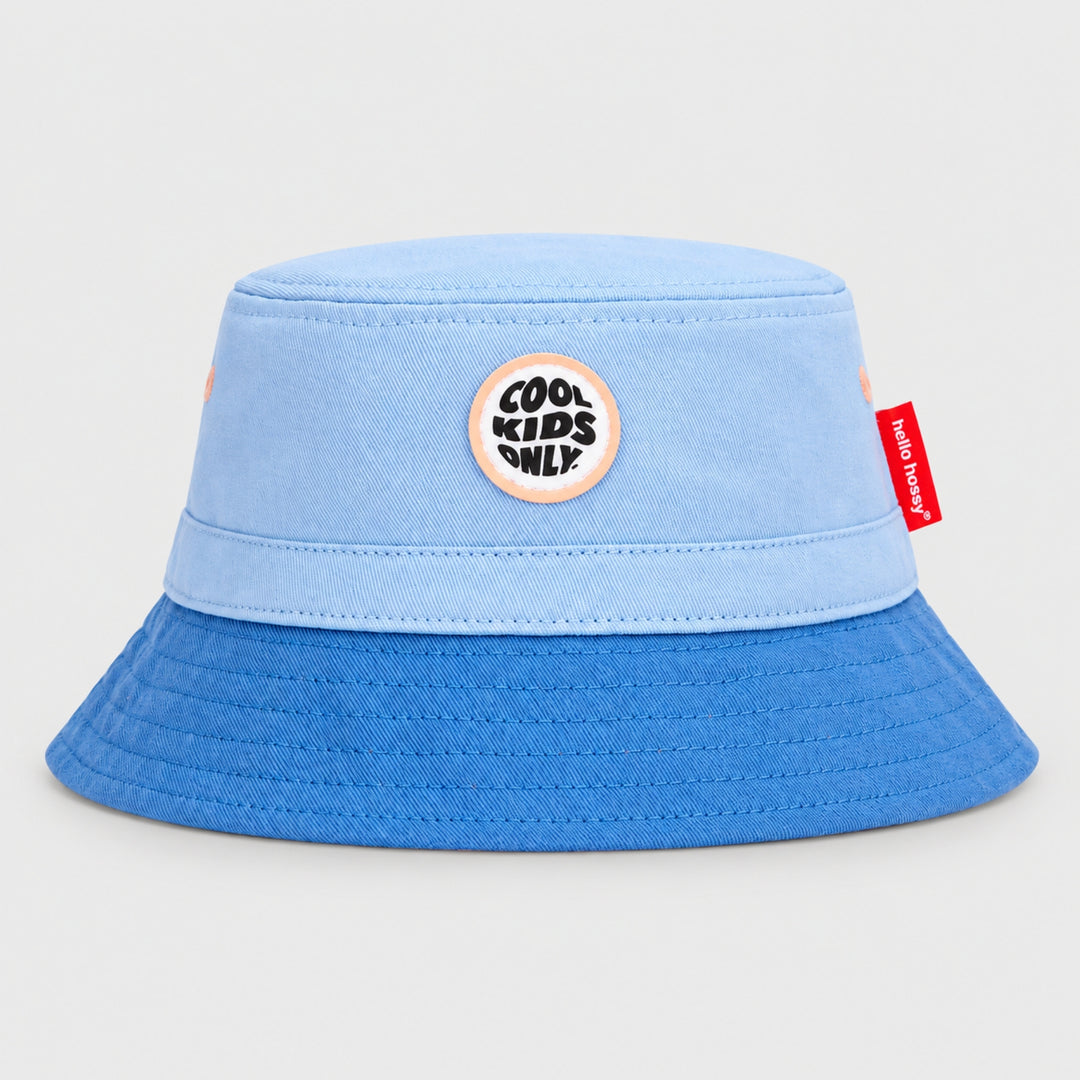 Hello Hossy light blue and royal blue bucket hat with “Cool Kids Only” front patch and red side tag.