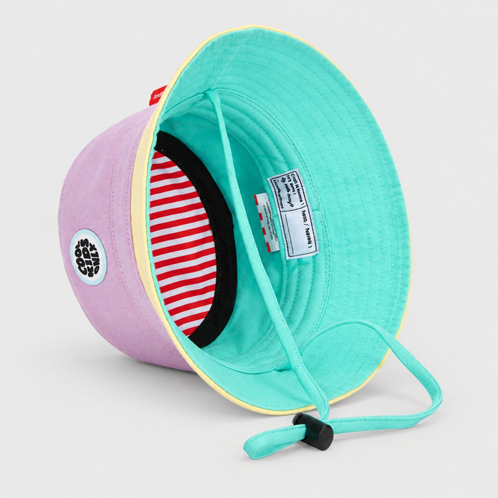 Interior view of the Hello Hossy lilac bucket hat showing mint lining, striped inner band, chin strap and product label.