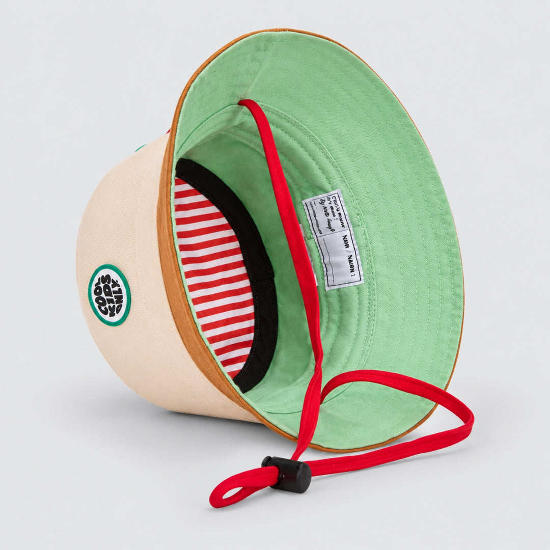 Interior view of the Hello Hossy cream and brown bucket hat showing mint lining, striped inner band, red chin strap and product label.