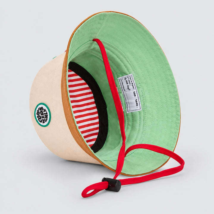 Interior view of the Hello Hossy cream and brown bucket hat showing mint lining, striped inner band, red chin strap and product label.