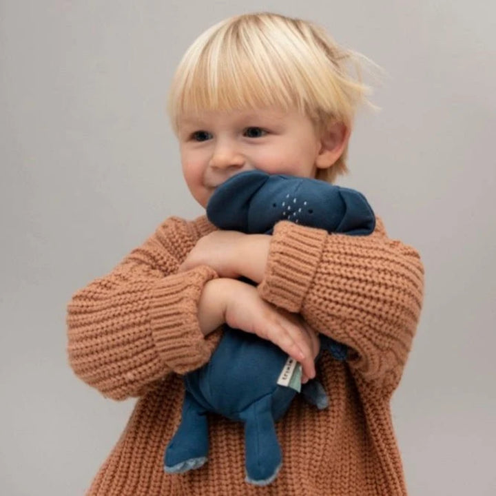Child cuddling Trixie Elephant soft toy, soft plush companion for toddlers UAE