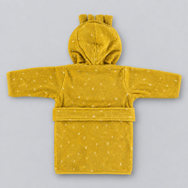 Back view of a mustard yellow children’s lion bathrobe laid flat on a light grey studio background, featuring a hood with small mane details, white speckled pattern, long sleeves and matching waist belt.