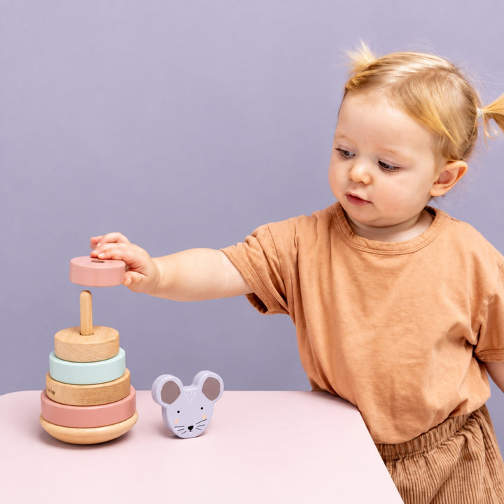 Toddler playing with Trixie Mouse wooden stacking toy, educational baby toy UAE