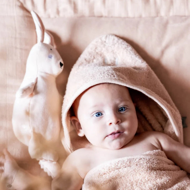 Baby wrapped in soft Trixie Rabbit hooded towel with bunny detail, newborn bath essential UAE