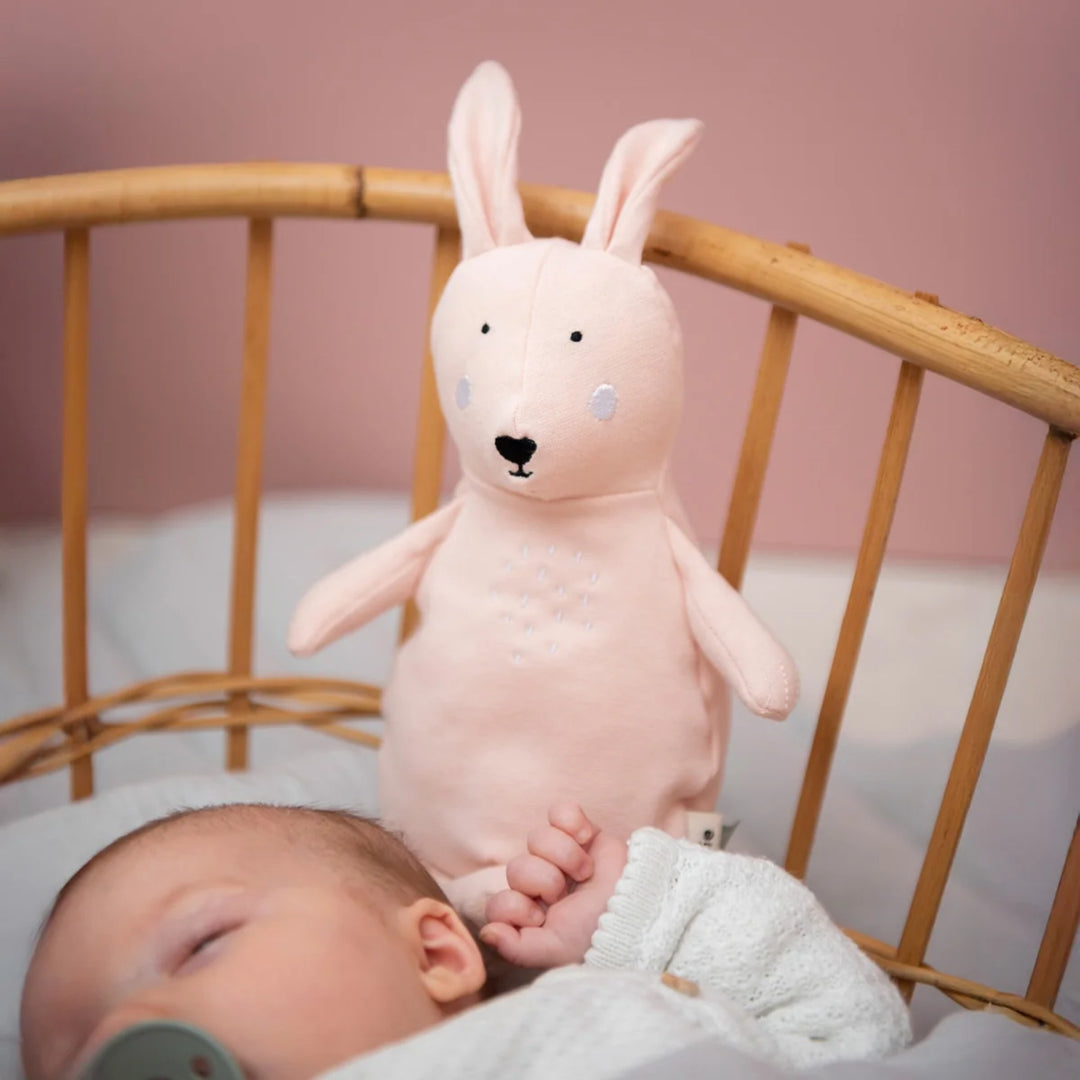 Trixie Rabbit soft toy beside sleeping newborn baby in a nursery, baby gift UAE