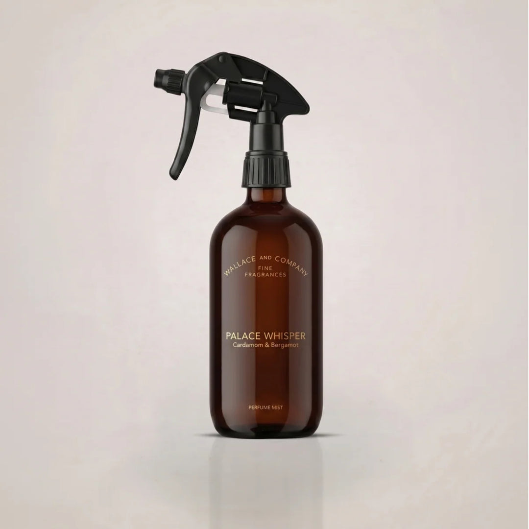 Wallace & Company Palace Whisper Cardamom & Bergamot Perfume Mist in an amber glass spray bottle with a black trigger.